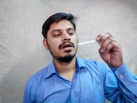 Man checking temporary using Thermometer 스톡 사진