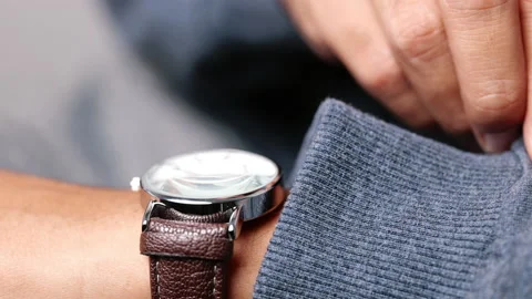 Man checking time in his watch - Close-up Stock Footage 158311558