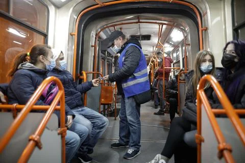 Man is checking transport tickets inside an old tram in Bucharest. Stock-Fotos