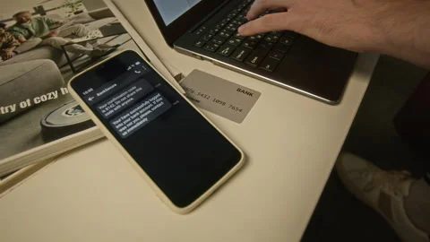 Man Checking Two-factor Security Code on Smartphone for Online Banking Vídeo Stock 344876381