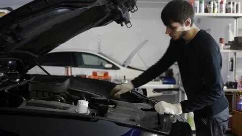 Man checks the engine oil Stock Footage 71193556