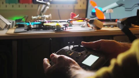 Man checks handmade quadrocopter Stock Footage 149843540