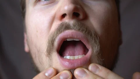 A man checks his lips and face Stock-Footage 124102171