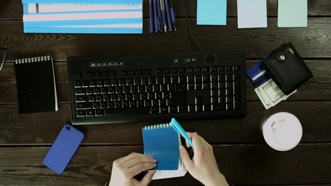 Man checks information which rewrites from the computer in notebook. Stock Footage 82015081