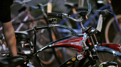 Man Checks to Make Sure Custom Bike is Locked Up. Stock Footage 61438744