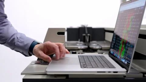 A man checks the parameters. Programming the control panels. Stock Footage 296106042