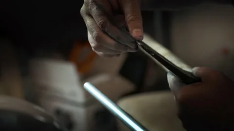 The man checks the sharpness of the ax with his finger Stock Footage 143673338