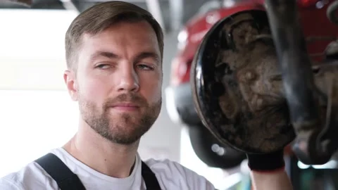 A man checks the technical condition of a car Stock-Footage 212345332