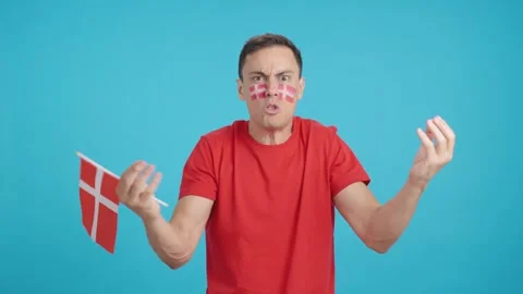 Man Cheering for Denmark, angry with the decision of referee Stock Footage 264995272