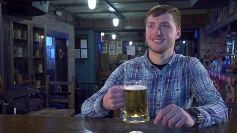 Man cheers with bartender Stock Photos