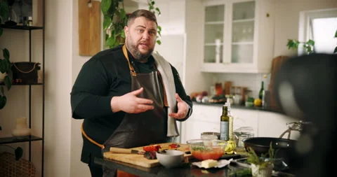 Man, chef and cooking with video camera for online tutorial, live recording or Stock Footage 306877533