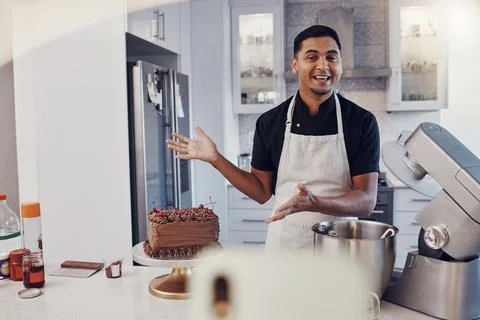 Man, chef and talking in kitchen on vlog, live streaming and recording a cake Fotos de archivo