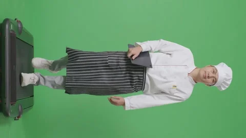 Man Chef Holding A Tablet While Walking On Treadmill In The Green Screen Stock Footage 246961134