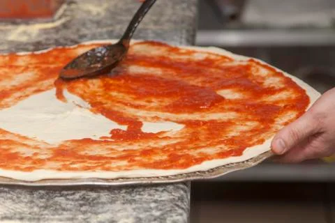 Man chef with raw pizza. Stock Photos