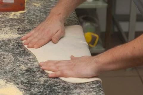 Man chef with raw pizza. Stock Photos