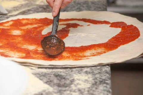 Man chef with raw pizza. Foto stock