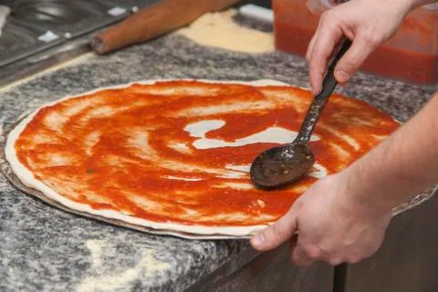 Man chef with raw pizza. Stock Photos