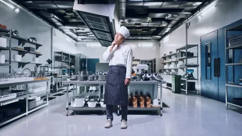 Man Chef Thinking And Looking Around Then Raising His Index Finger In Kitchen Stock Footage 273244668