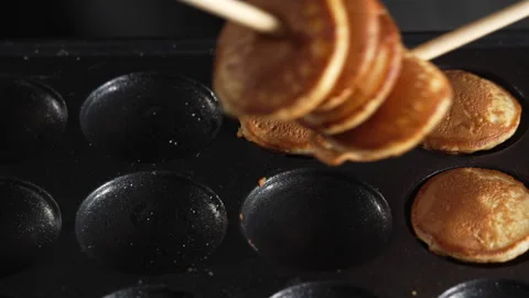 Man chef use chopsticks to pack delicious mini pancakes in the box Stock Footage 321055017