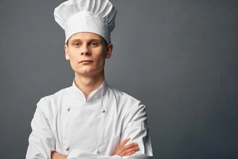 Man in chef's uniform professional restaurant job gourmet Stock Photos