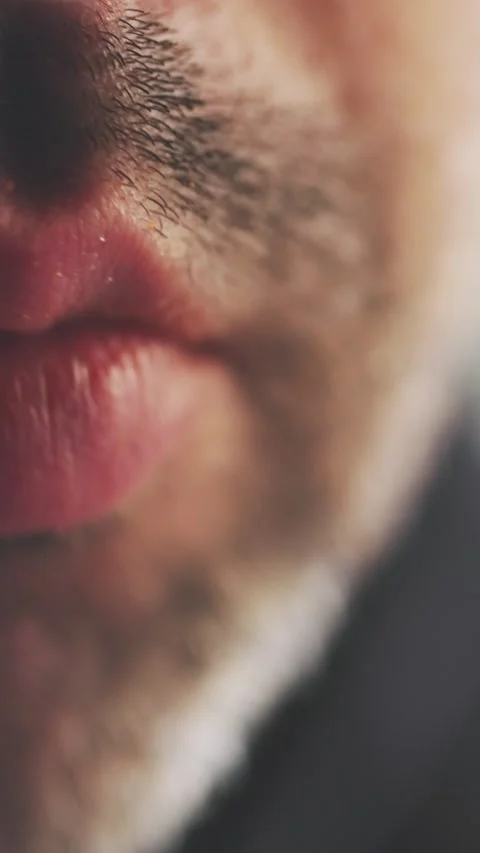 Man Chewing with Full Lips and Stubble Macro Shot Vertical Video Stock Footage 314925879
