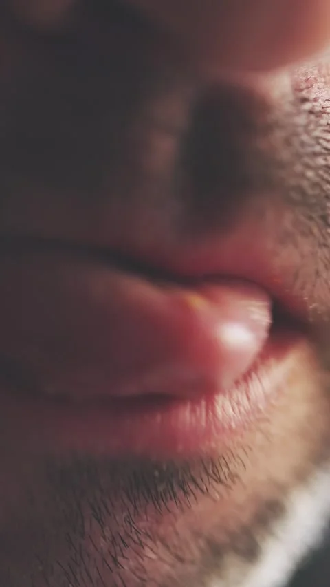 Man Chewing with Full Lips and Stubble Macro Shot Vertical Video Stock Footage 314925956