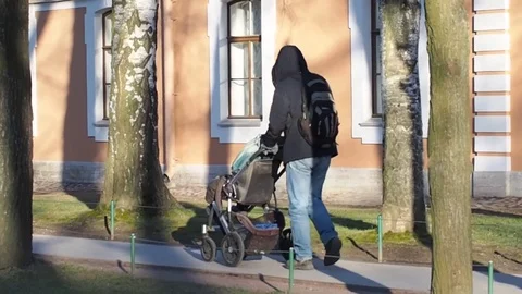 The man with the child in the stroller Stock Footage 89299853