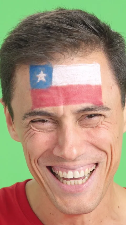 Man with a chilean flag painted on the face smiling Stock Footage 258821432