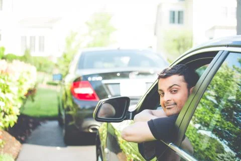 Man chilling on car Stock Photos