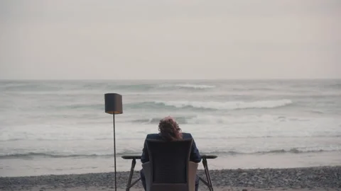 Man Chilling On Isolated Beach Stock Footage 147537971