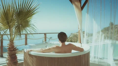 Man Chilling in Warm Jacuzzi Stock Footage 302331844