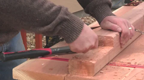 Man chiseling wood Stock Footage 22822559