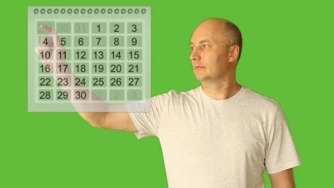 Man choice date on calendar. Planning period of month. Plan vacation season Stock Photos
