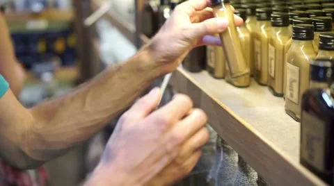 Man choose a drink in a store Stock Footage 66787553