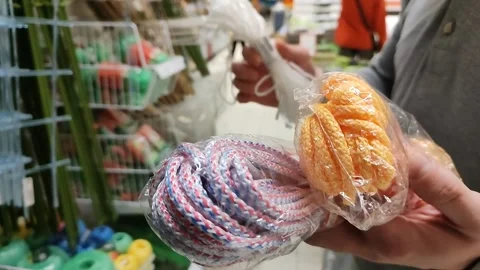 Man choose rope in hardware store or home and garden goods store Stock Footage 220445540