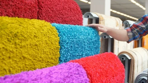 Man chooses carpet,close up Stock Footage 90508124