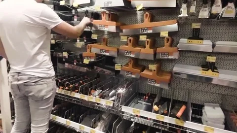 A man chooses a construction tool 스톡 동영상 78700171