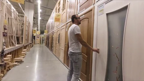 The man chooses the interior doors Stock Footage 78700182