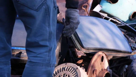 A man chooses an old broken TV in a landfill Stock Footage 86831669