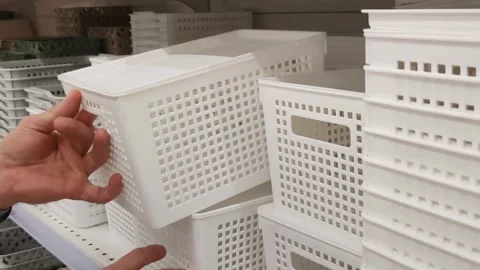 Man chooses plastic container at hardware store 스톡 동영상 287842191