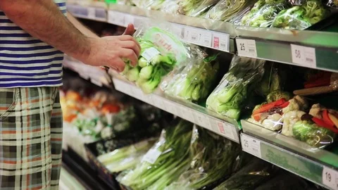 Man chooses products in the store Stock Footage 75569353