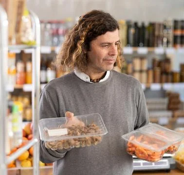 Man chooses shrimp and shellfish Stock Photos