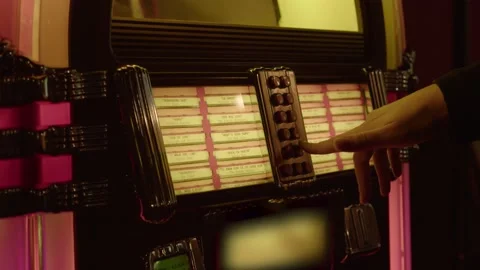 Man chooses a song in the jukebox Video stock 230984890