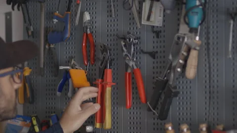 Man chooses a tool from his laboratory, bricolage and "do it yourself" concept Stock Footage 141506842