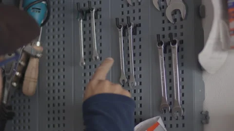 Man chooses a tool from his laboratory, bricolage and "do it yourself" concept Stock Footage 141508429