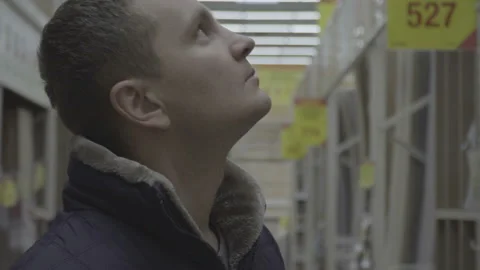 Man choosing and buying construction materials for his house in a big store Video stock 85629720
