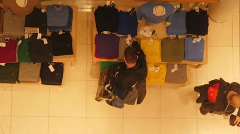 Man choosing clothes in shop Video stock 45845851