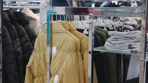 Man Choosing Clothes In Shop Stock Footage 56059215