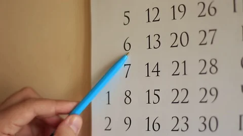 Man is Choosing Date by the Pen at the Calender 스톡 동영상 70505482