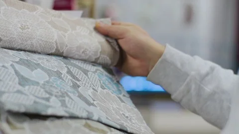 Man choosing Fabric Samples Of Different Colors for sofa Stock Footage 91141593